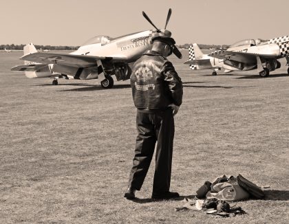 USAAF pilot in front of North American P-51D Mustangs, Flying Legends Duxford